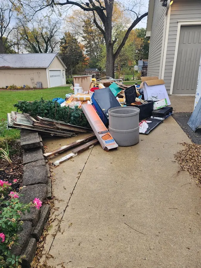 Dumpster being loaded with debris for Residential Dumpster Rental in Avalon